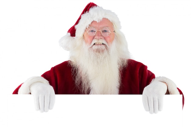 Santa regarde par-dessus un signe