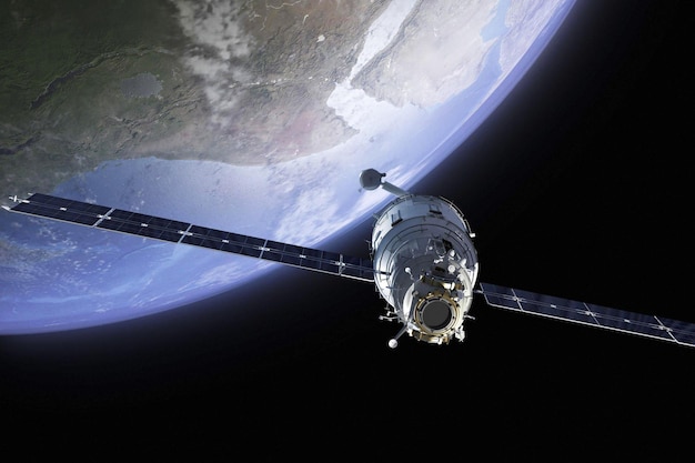 Photo un satellite dans l'espace avec la terre en arrière-plan
