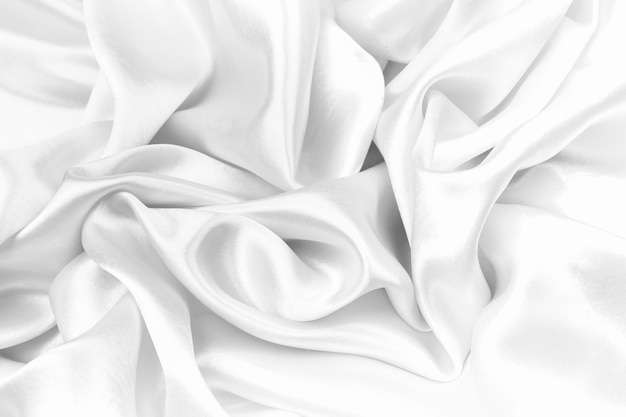 Satin luxueux de texture de soie blanche pour abstrait.