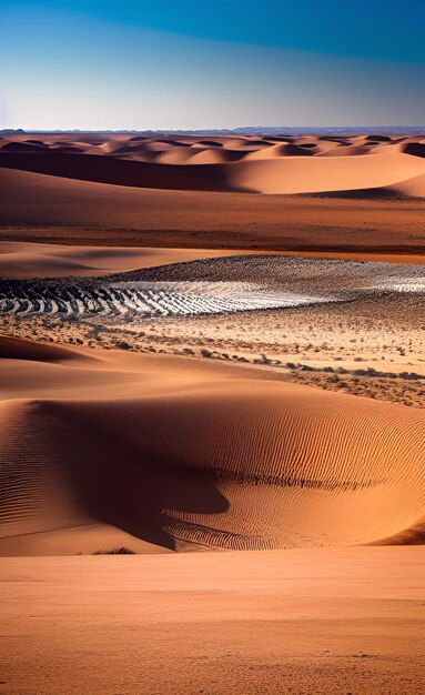 Une scène de désert avec des dunes de sable et un ciel bleu