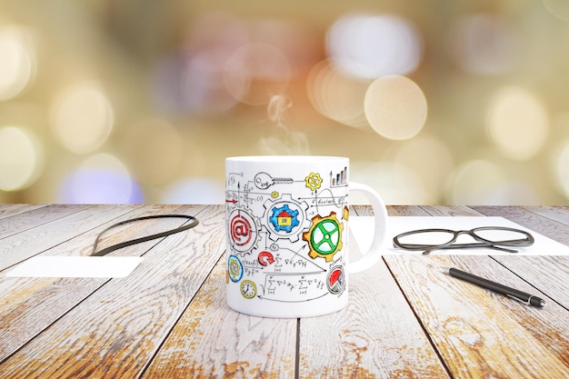 Schémas d'affaires conceptuels dessinés sur une tasse de café