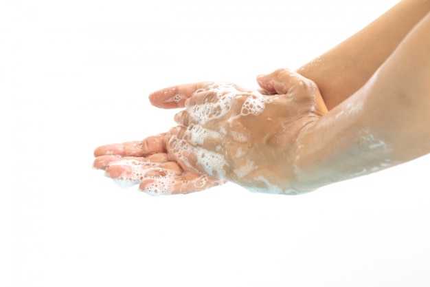 Se laver les mains avec du savon isoler sur fond blanc.