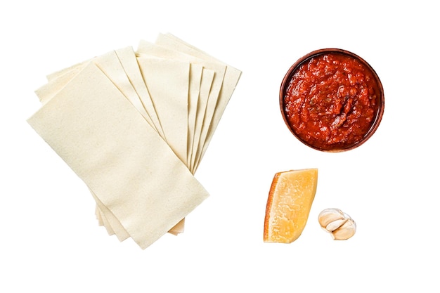 Set d'ingrédients pour cuisiner la lasagne gros plan de sauce tomate pâtes fromage fond en bois vue supérieure