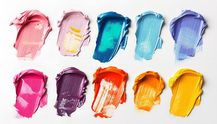 Photo set avec des traits de peintures à l'huile colorées sur fond blanc vue supérieure