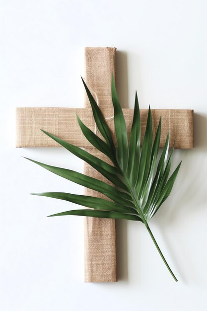 Photo un signe de crucifix de croix chrétienne en bois avec des feuilles de palmier vert comme fête religieuse événement du dimanche des rameaux