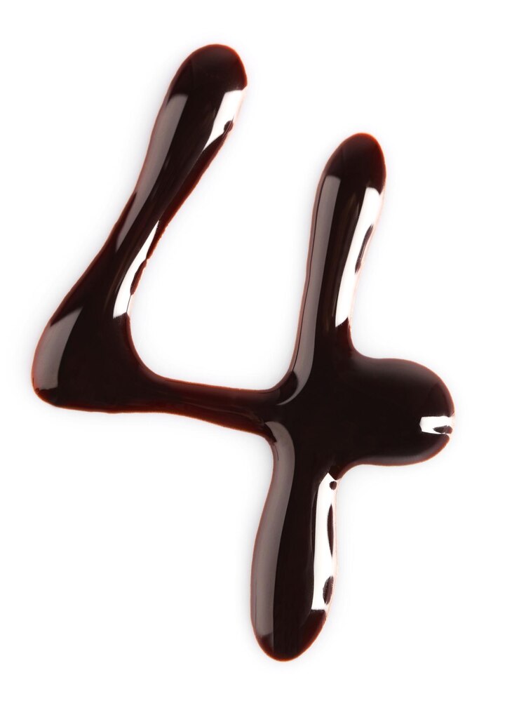 Photo silhouette de chocolat dessiné figure quatre isolé sur blanc