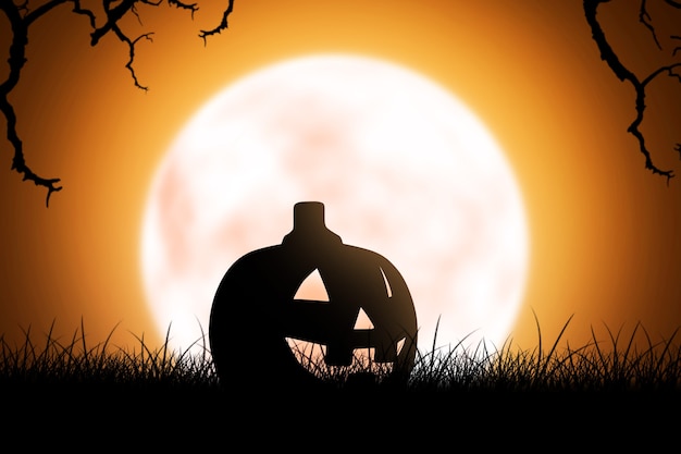 Silhouette de Jack-o-Lantern sur l'herbe avec fond de pleine lune