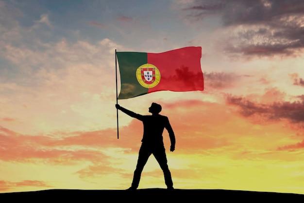 Silhouette masculine agitant le drapeau du Portugal rendu 3D