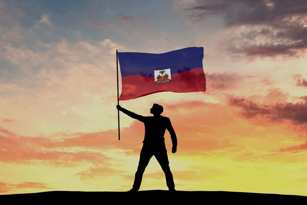 Silhouette masculine agitant le drapeau d'Haïti rendu 3D