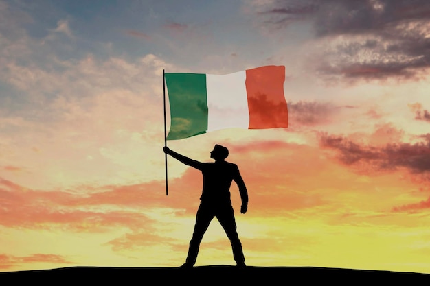 Silhouette masculine agitant le drapeau de l'Irlande rendu 3D