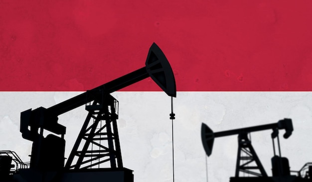 Silhouette de pompe à huile de fond de l'industrie pétrolière et gazière contre le rendu d du drapeau indonésien