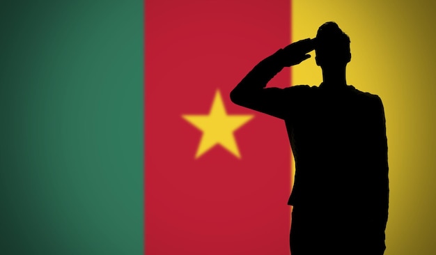 Silhouette d'un soldat saluant contre le drapeau camerounais