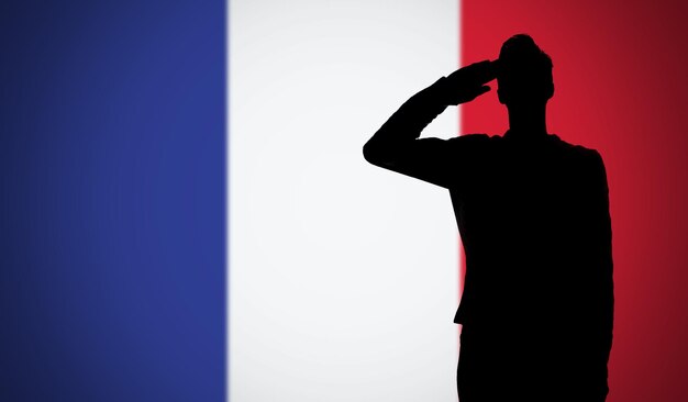 Photo silhouette d'un soldat saluant contre le drapeau de la france