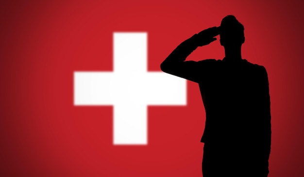 Silhouette d'un soldat saluant contre le drapeau suisse