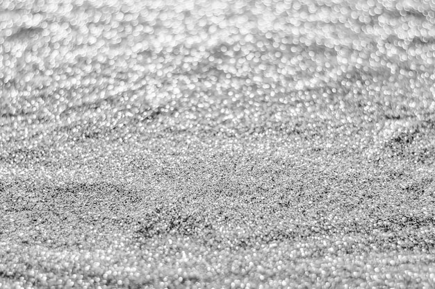 Silverbokeh abstrait de paillettes floue