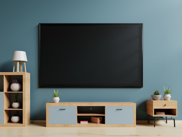 Smart TV sur le stand et le mur de fond bleu. Rendu 3D