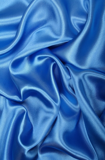 La soie bleue et élégante comme fond