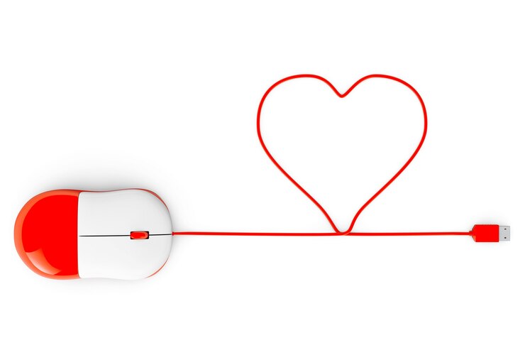 Photo souris d'ordinateur et câbles en forme de coeur sur fond blanc