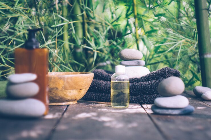 Photo spa avec des feuilles de bambou et des pierres