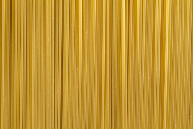 Des spaghettis crus en gros plan, de haute qualité, un concept photo magnifique.