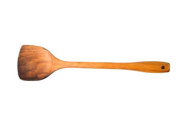 Spatule de cuisine en bois sur fond de bois