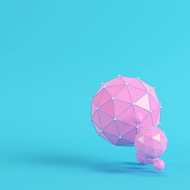 Sphères abstraites low poly rose sur fond bleu clair