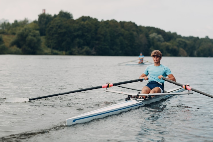 Photo sportsman seul homme rameur aviron sur bateau