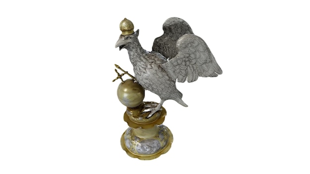 Une statue d'une cigogne avec un globe dessus