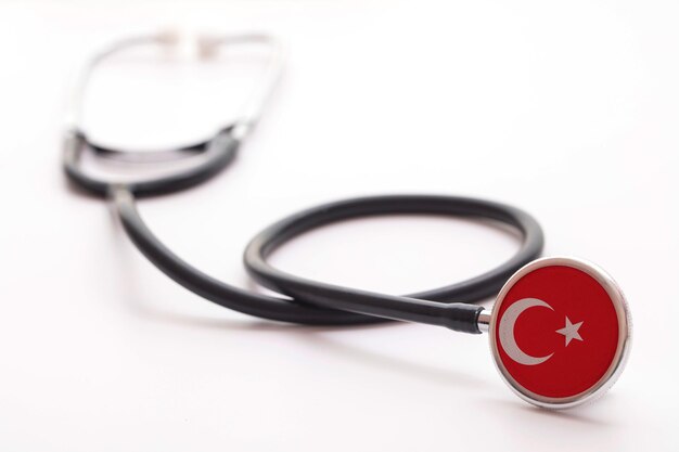 Stéthoscope médical de concept de soins de santé de la Turquie avec le drapeau de pays