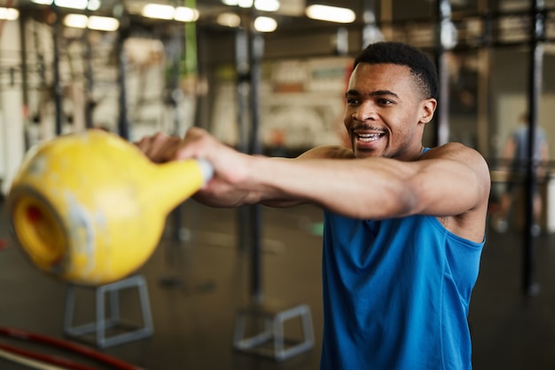 Strong Man Swinging Kettlebell