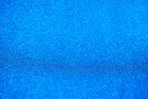 Studio de fond de perspective de mur et de sol de paillettes étincelantes bleu marine vif foncé abstrait avec flou bokehluxury fond de vacances maquette pour l'affichage de la carte de voeux festive productholiday