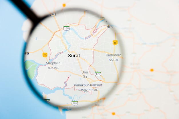 Surat city visualization concept illustratif sur l'écran d'affichage à travers une loupe