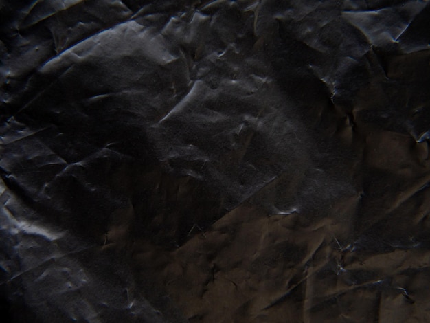 Surface du sac en plastique noir Peau irrégulière et ridée