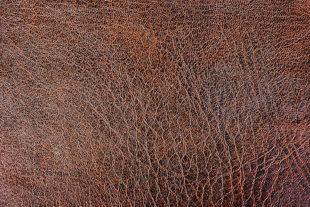 La surface de l'éco-cuir marron. Fond, texture du cuir.