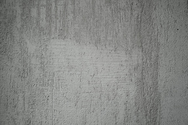 Surface de mur en béton brut gris