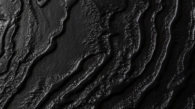 Surface noire texturée avec des lignes ondulées