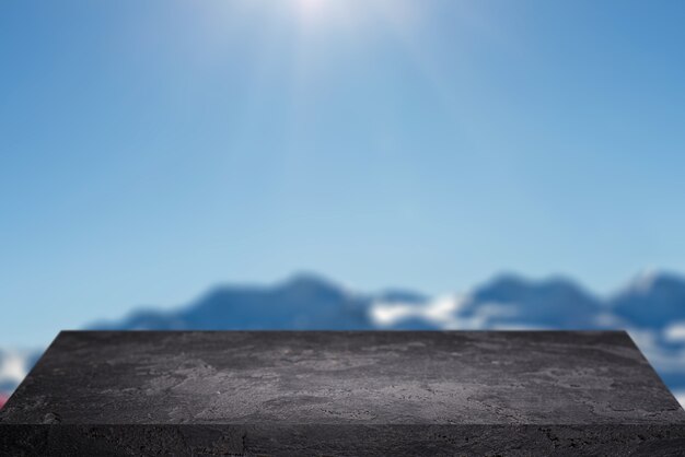 Surface en pierre noire contre le ciel bleu avec des collines pendant la journée