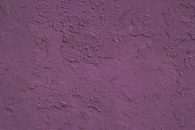 Une surface plâtrée de fond de couleur violette