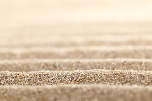 Surface de sable ondulée abstraite.