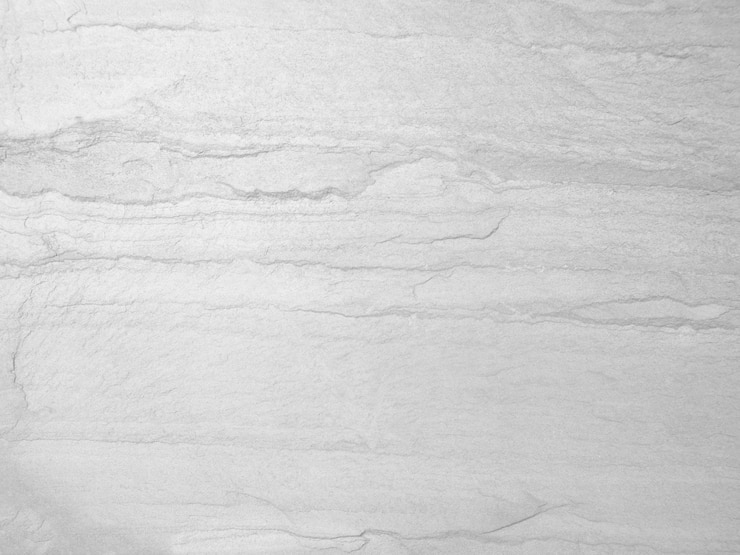 Photo surface de la texture de pierre blanche ton gris blanc rugueux utilisez ceci pour le fond d'écran ou l'image d'arrière-plan il y a un espace vide pour textx9