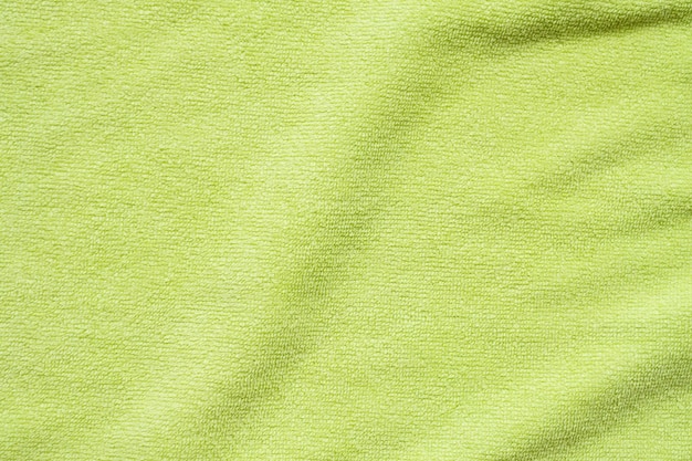 Surface de texture de tissu de serviette verte bouchent l'arrière-plan