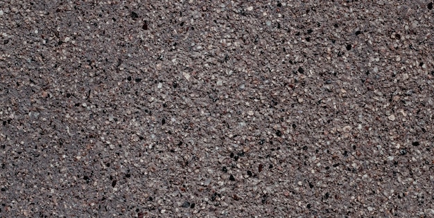 Une surface texturée grise et noire avec une surface rugueuse.