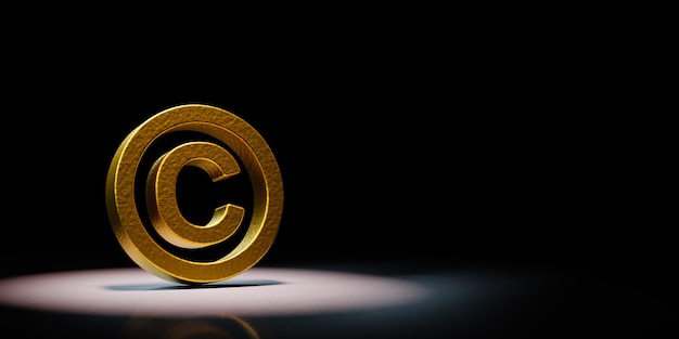 Symbole de copyright doré mis en évidence sur fond noir