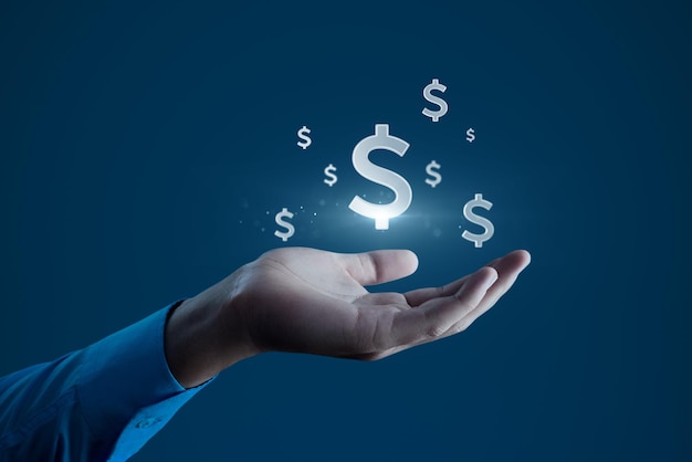 Le symbole du dollar dans la main, l'icône de la finance et le concept de la richesse