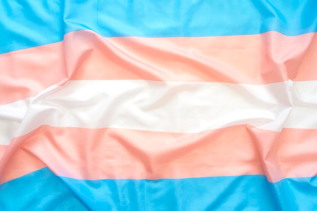 Symbole en tissu des personnes transgenres drapeau transgenre comme image de concept de vue de dessus d'arrière-plan