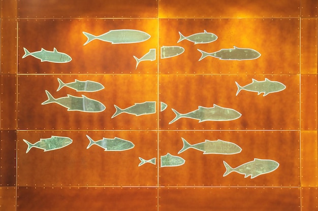 Symboles de poisson sur le mur