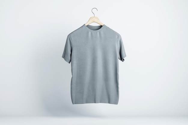 T-shirt gris blanc suspendu dans les airs avec espace de copie pour votre texte sur fond clair maquette de rendu 3D