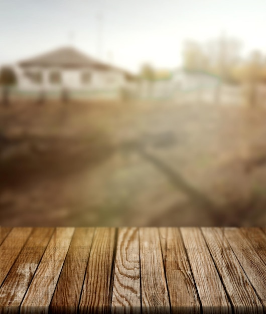 table en bois dans le jardin vue sur la campagne fond de texture flou