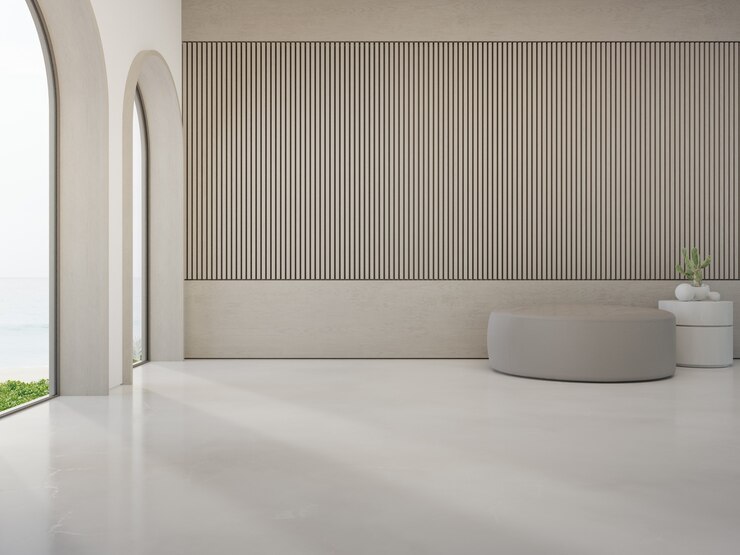 Photo tabouret rond sur sol en béton blanc d'un salon lumineux dans une maison de plage moderne ou un hôtel de luxe