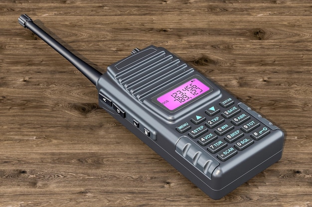 Talkie-walkie radio portable sur la table en bois rendu 3D
